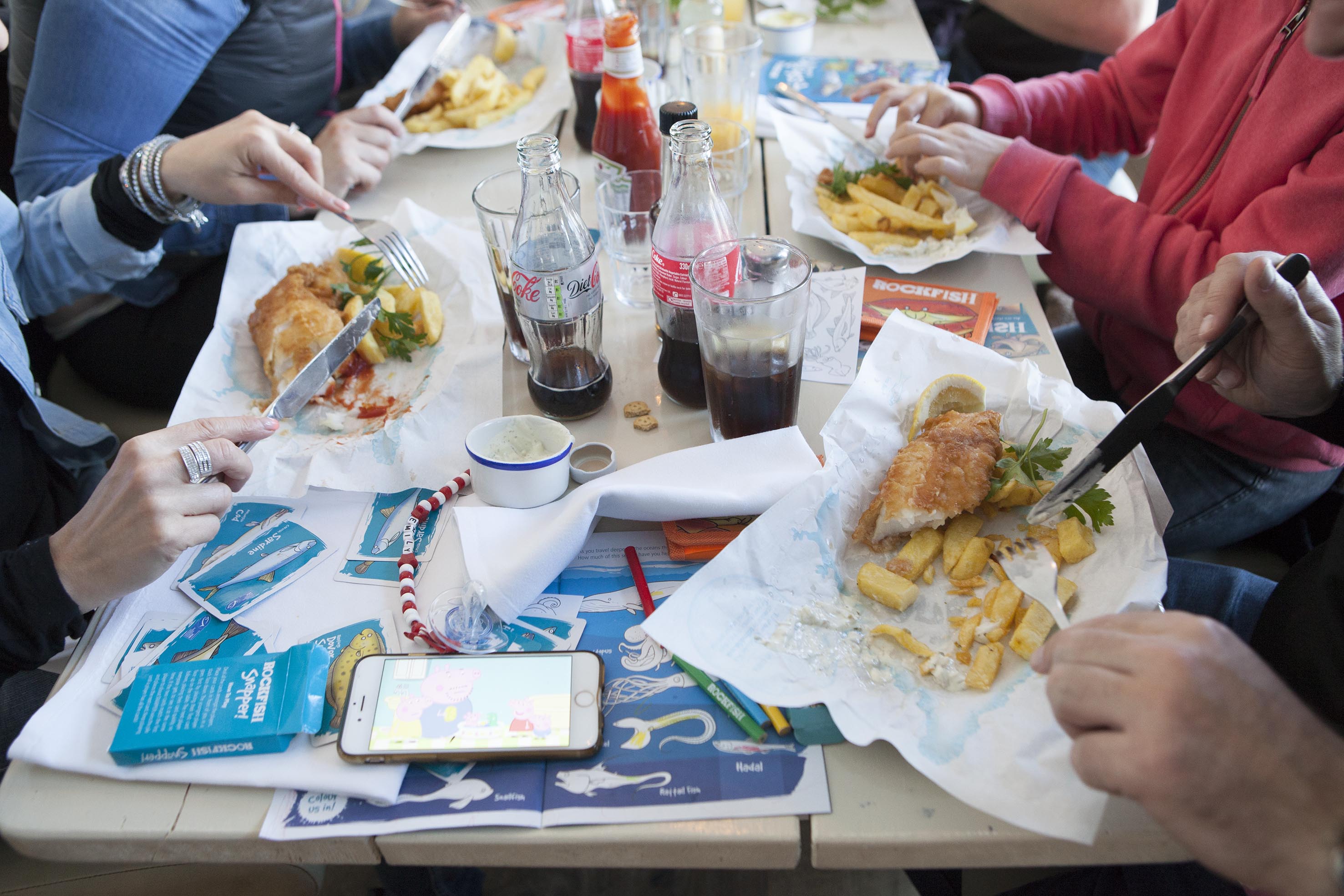 Satisfied customers eating fish and chips at RockFish