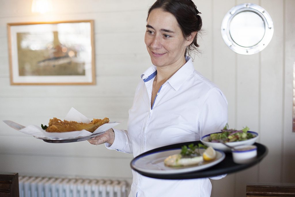 Waitress serving lunch at RockFish