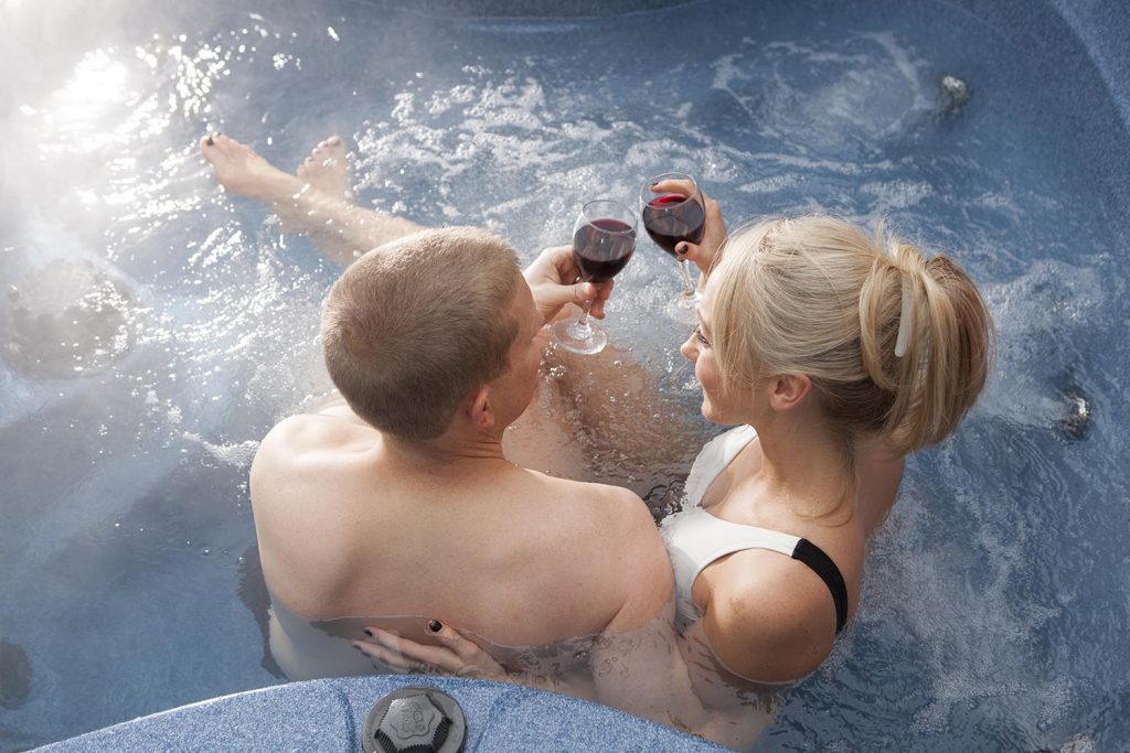 Couple spending quality time together on holiday in hottub