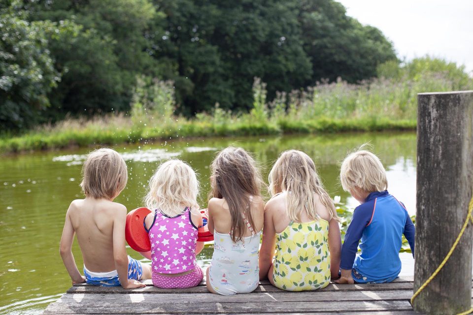 Children by a swimming pond