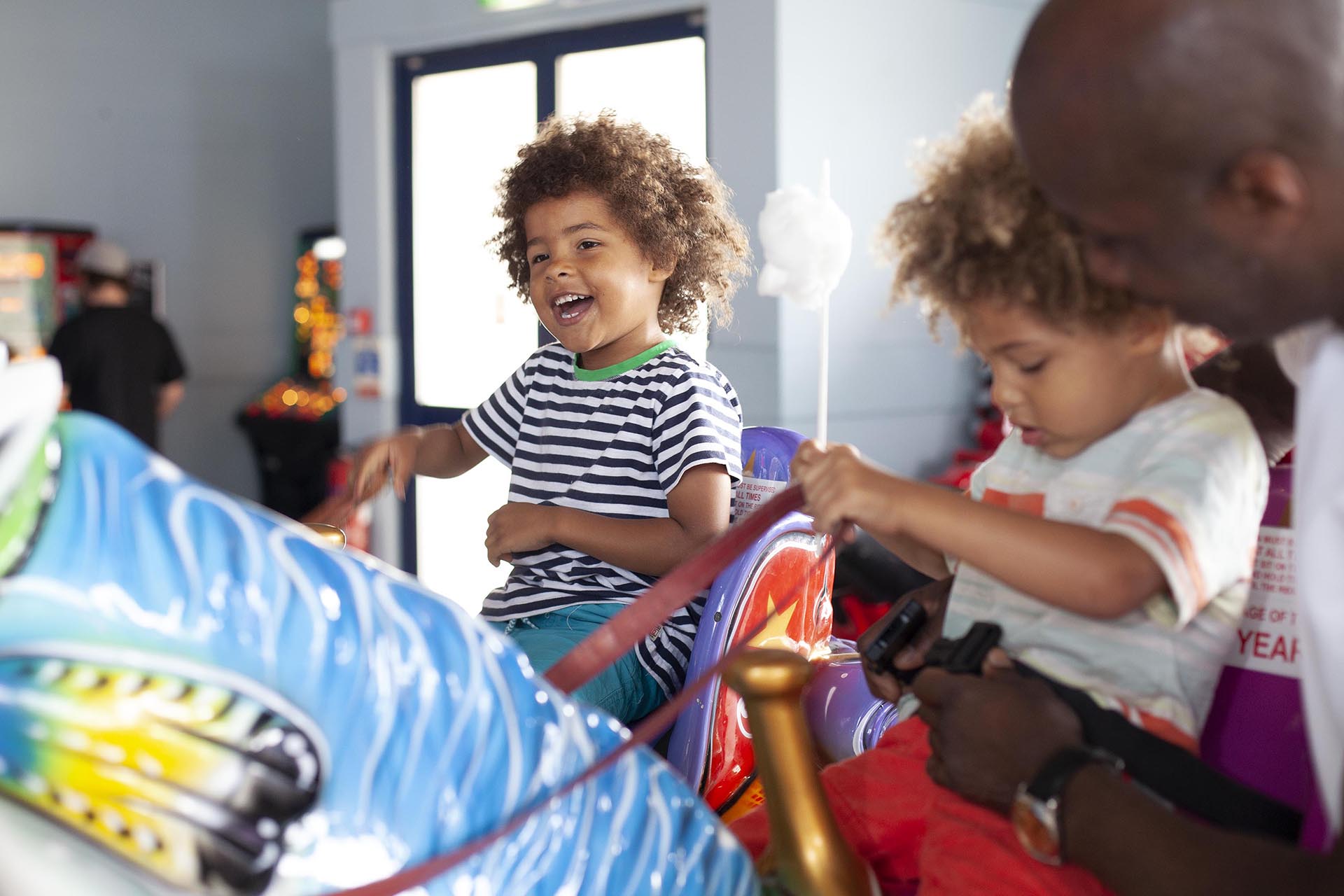 Children enjoying fairground rides