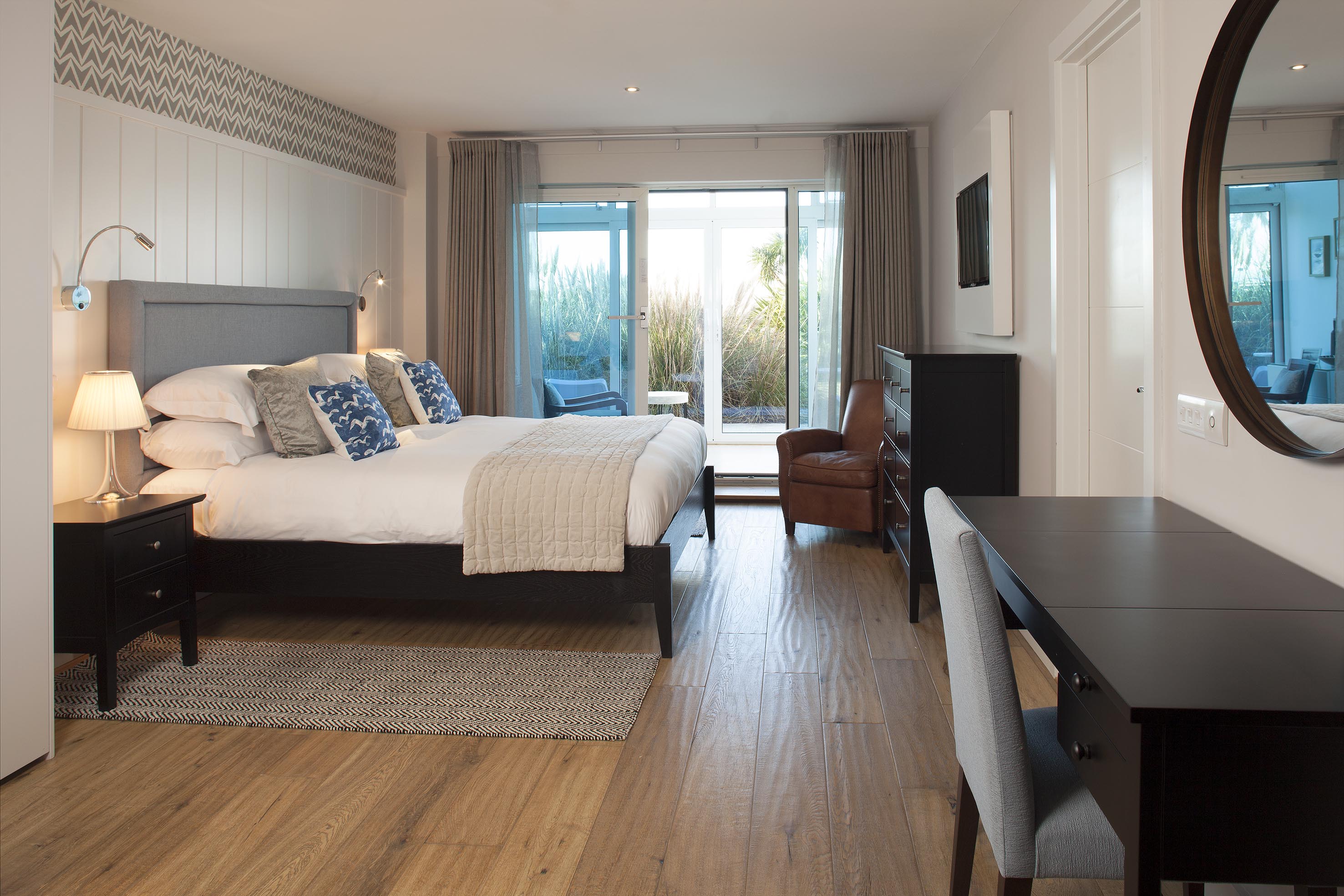Interior shot of St Moritz Hotel bedroom interiors and sunset exterior