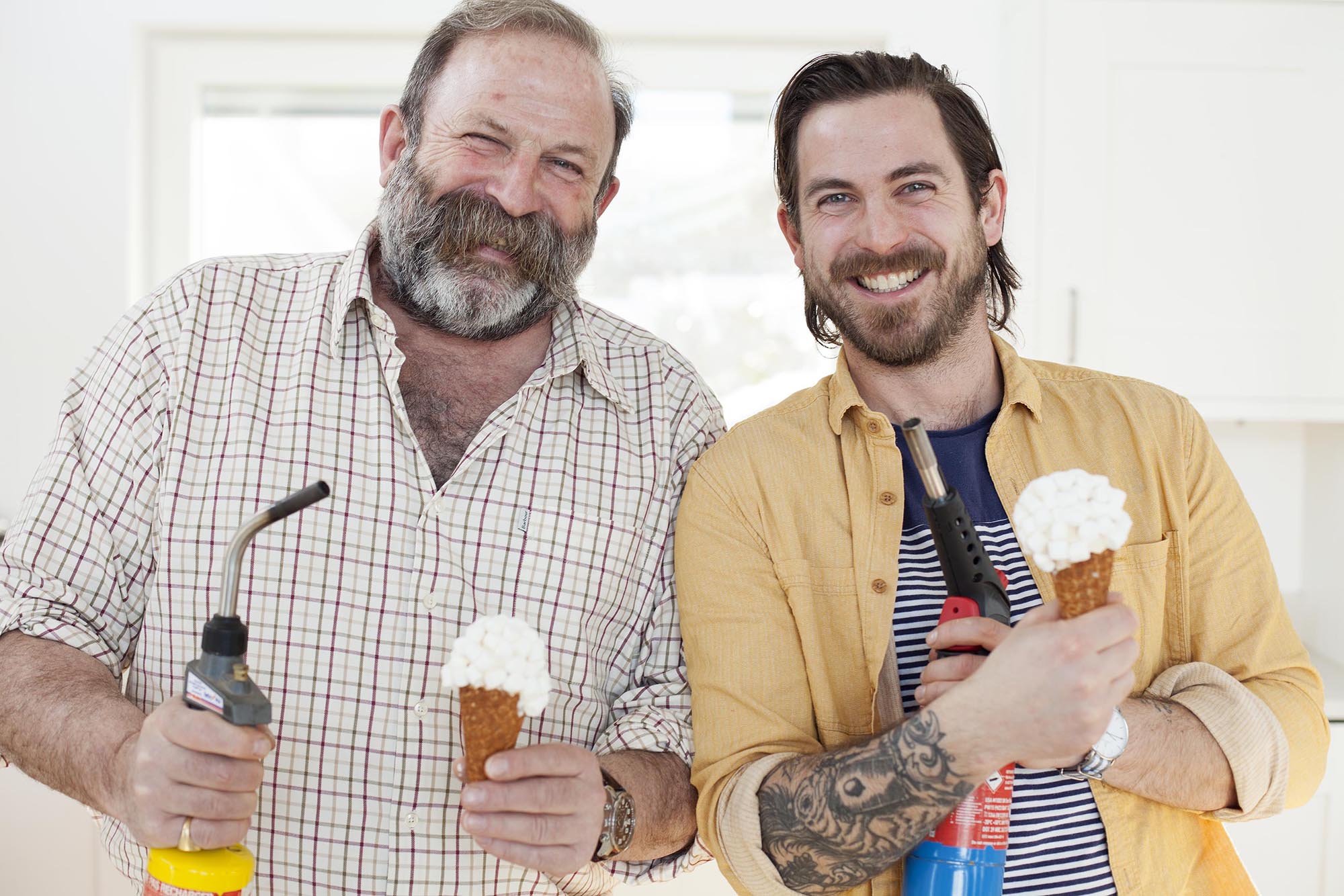 Father and son holding ice cream