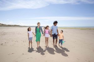 Family holiday on beach in Wales Brynowen